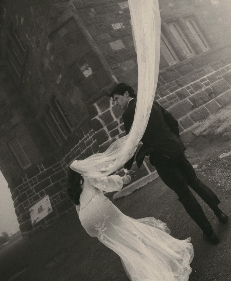 Wedding couple with a flowing veil